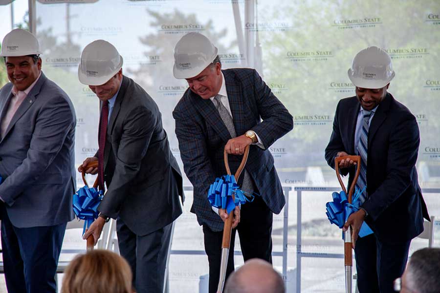 From L-R: Mayor Andrew Ginther, Columbus State President David Harrison, Cameron Mitchell, and President of the Franklin County Board of Commissioners Kevin Boyce break ground on the new facility.