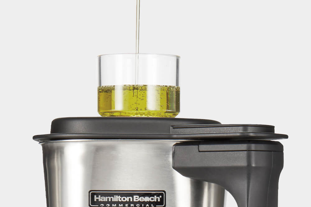 Olive oil in a Hamilton Beach dosing cup.
