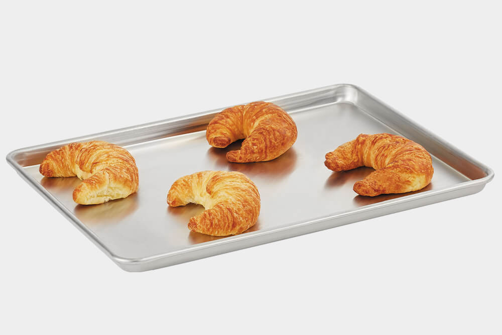 This 2/3 size Wear-Ever® sheet pan from Vollrath® features impact resistant, 3000 series aluminum and the tapered design allows for easy stacking. Perfect for bakeries. 