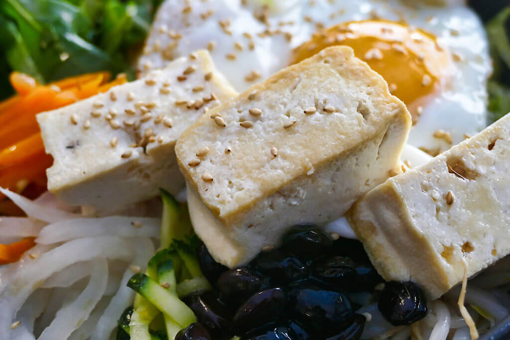 Sesame seeds, tofu, and vegetables