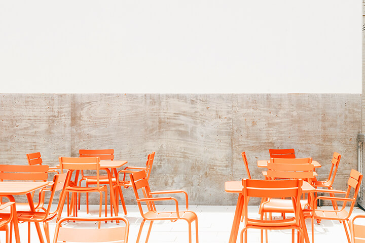 Light orange chairs for an airy restaurant design.
