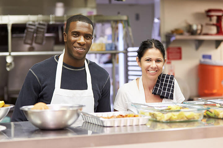 Two employees who deserve the best in health care and respect. Sick foodservice employees have a hard time not breathing or touching the food.