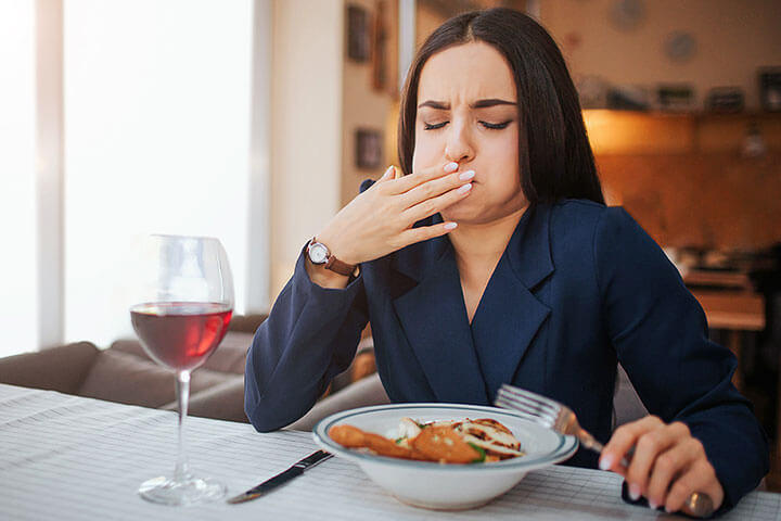 Uh oh, a woman is sick at her table. Sick foodservice employees. 