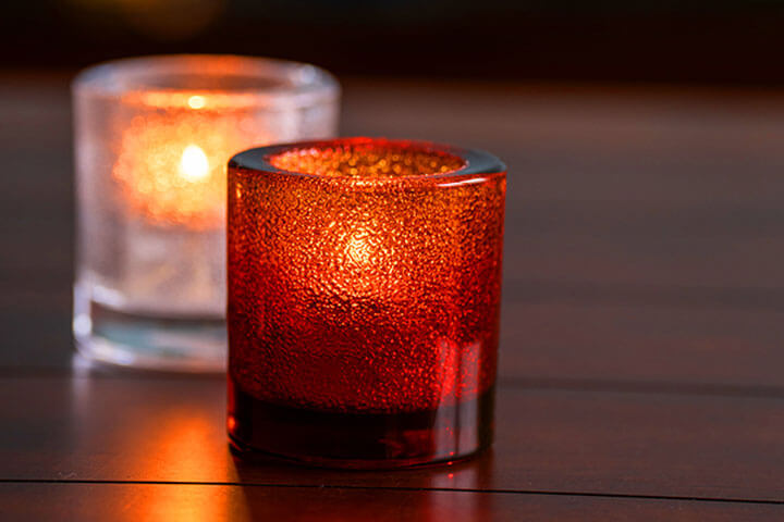 Thick, round tealight holders to illuminate a table.