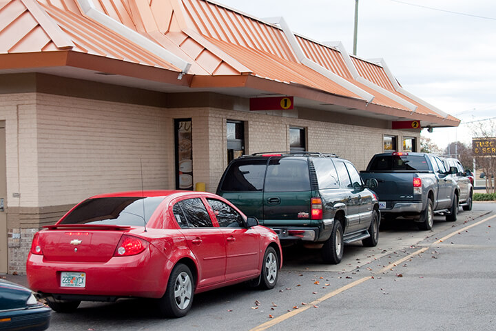 Cars line up outside of a fast-food restaurant. Wendy's is looking to remedy this problem.