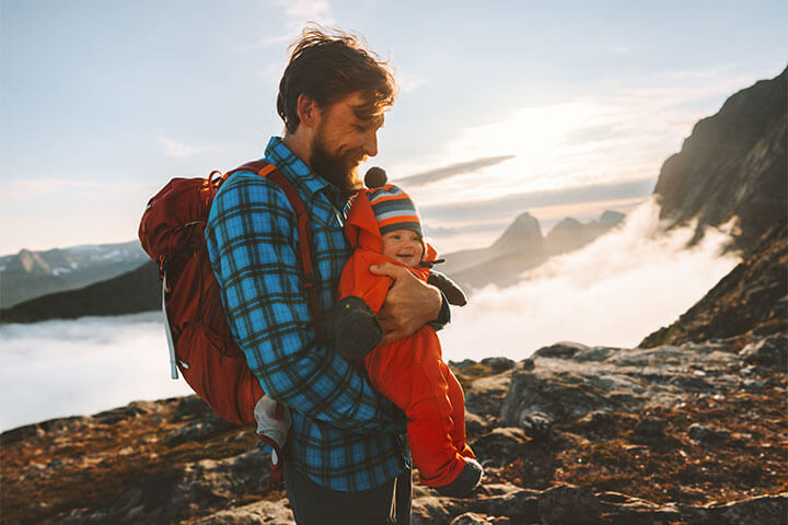 The whole family is invited. Photo of a dad and baby.