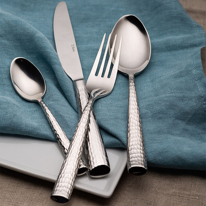 Sola Miracle by Arc Cardinal with a hammered flatware finish.