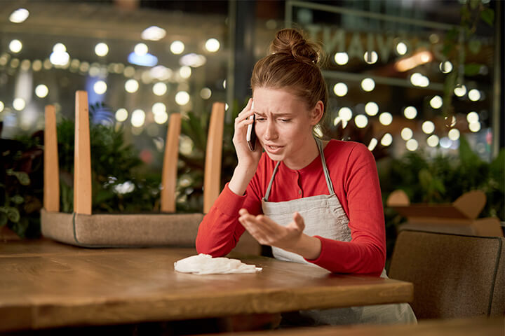 An employee airs her grievances on the phone.