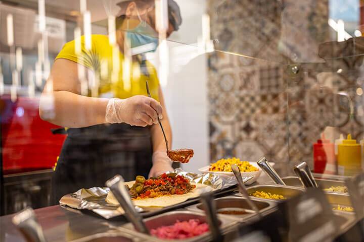 Foodservice worker wearing PPE.