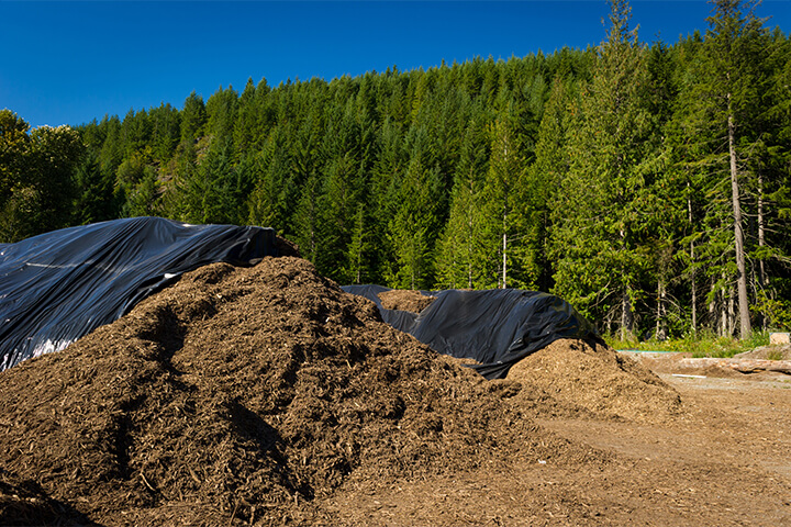 Industrial composting is the large-scale processing of organic waste into compost.
