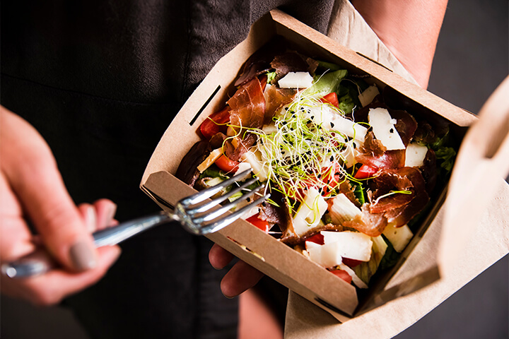 An eco-friendly box full of fresh food.