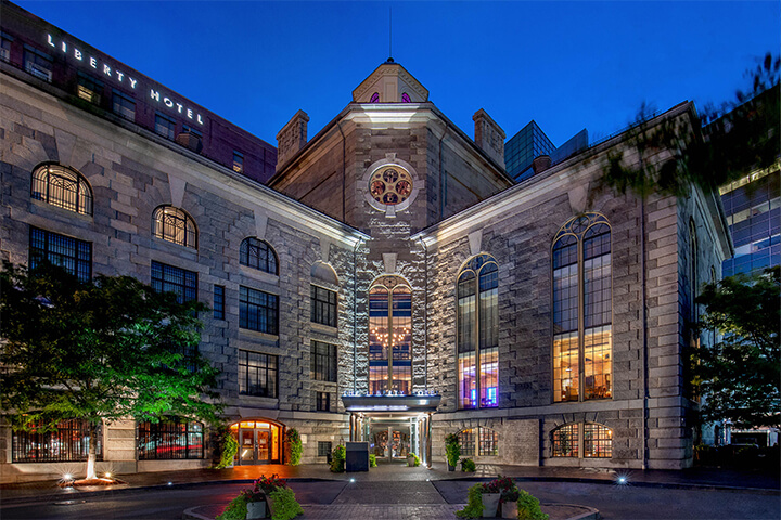 The Liberty Hotel in Boston began as the Charles Street Jail in 1851. "The interior design team was tasked with infusing the hotel with a distinctive personality that honors the building’s rich history while imparting contemporary vibrancy."