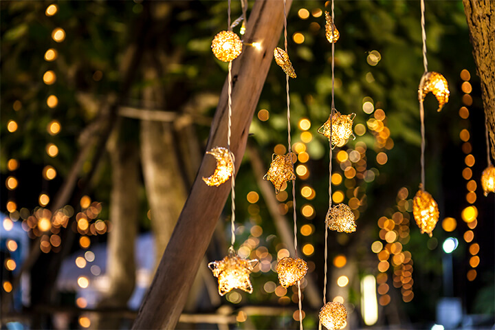 String lights resembling stars and moons. 