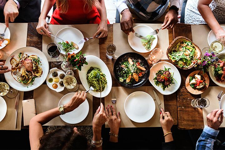 A group of people chow down on a big dinner.