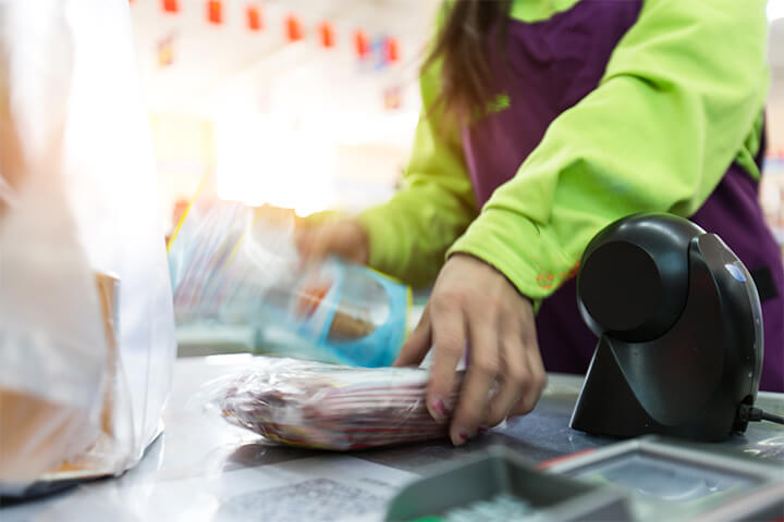 A cashier rings up an order. 