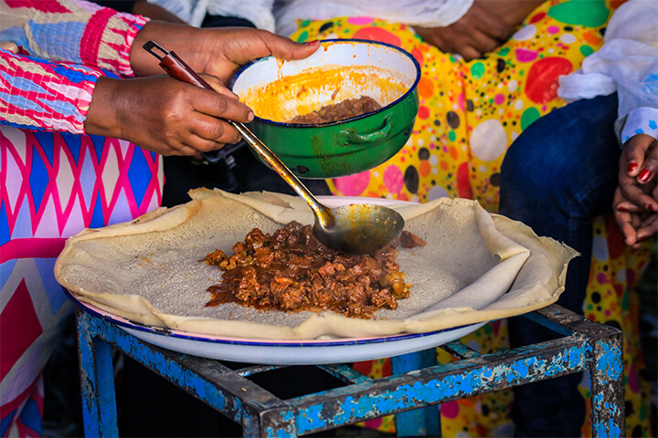 Woman prepares a hearty meal.