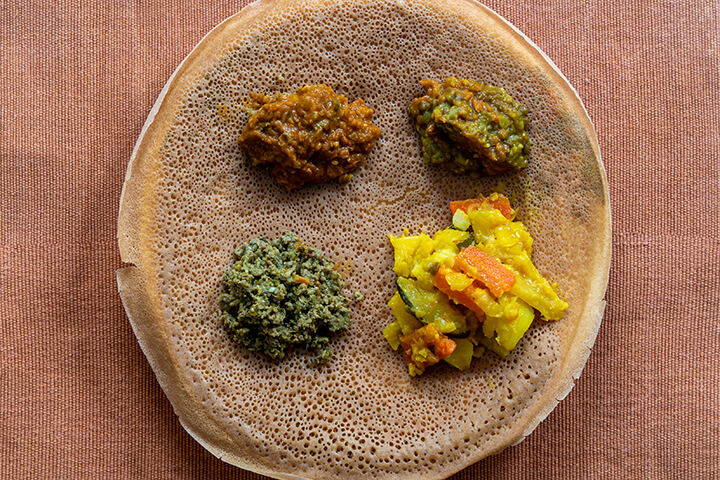 Injera with lentils and vegetables.