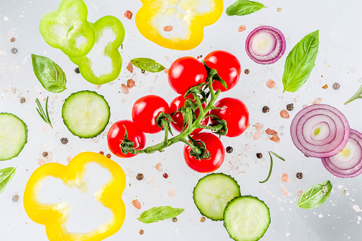 Streamline your menu. Vegetables flying in the air represents the chaos of a bloated menu.