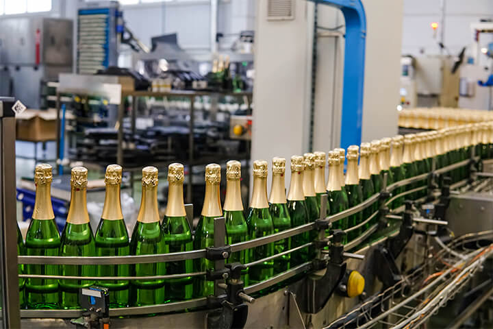 Wine bottles on an assembly line.