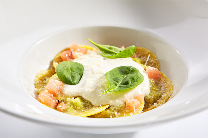 Ravioli with cheese espuma.