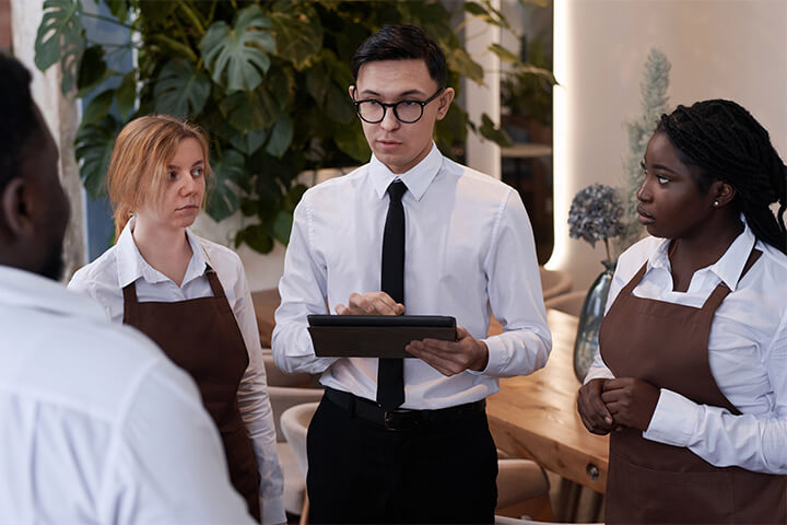 A young, burned out manager addresses his staff about an upcoming buffet or banquet.