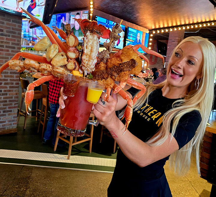 Photo courtesy of the Northern Taphouse in Lakeville, MN. Drink includes a lobster tail, snow crabs, jumbo Cajun dill shrimp, steak skewers, bacon-wrapped scallops, mini beef wellingtons, and coconut shrimp.