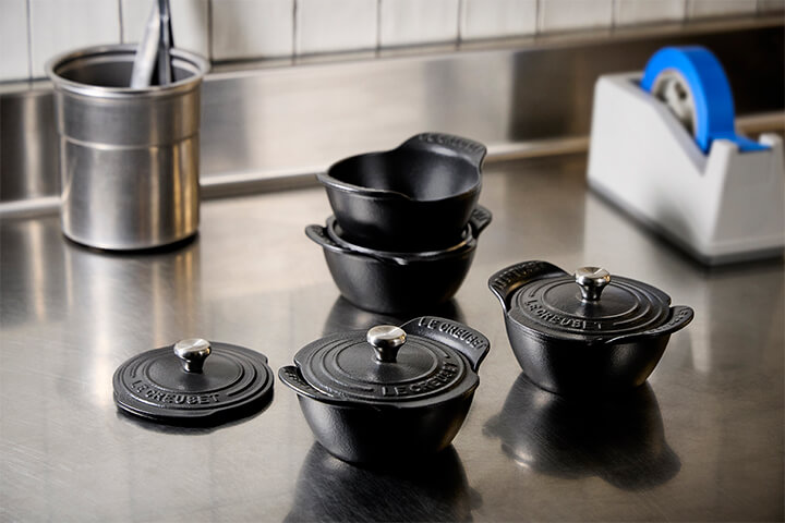 Le Creuset's Gourmand collection with lids.