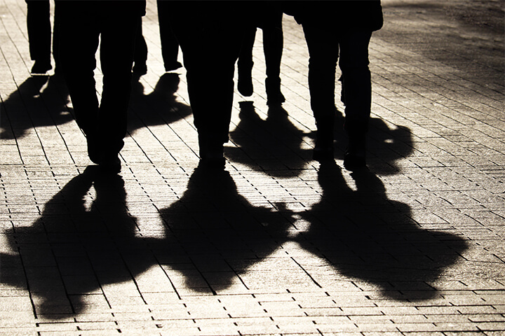 A group of shadowy figures. 