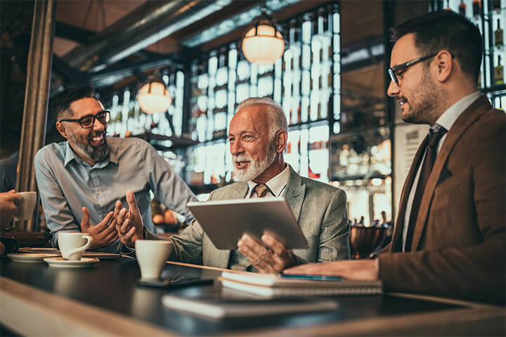 An older gentleman with two younger associates. 
