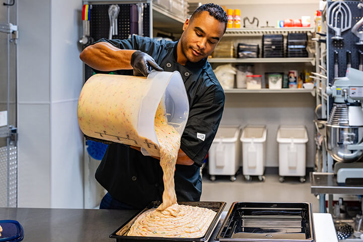 A man pours a large amount of battery, easily.
