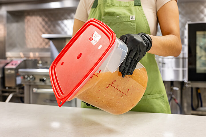 A woman tests the strength of a seal cover. 