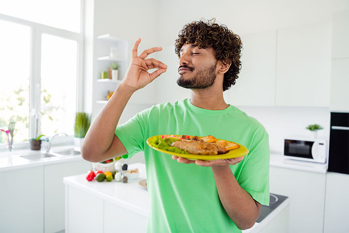 A man is happy with his food. 