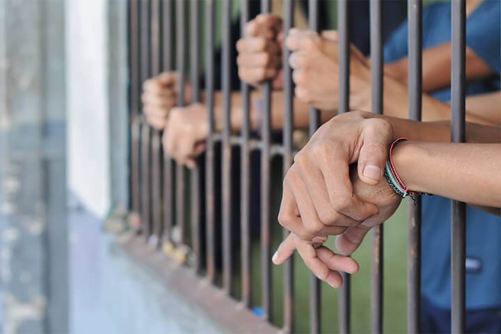 Prisoners wait for their food.