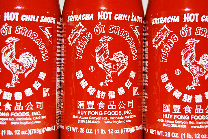 Sriracha bottles, close up.