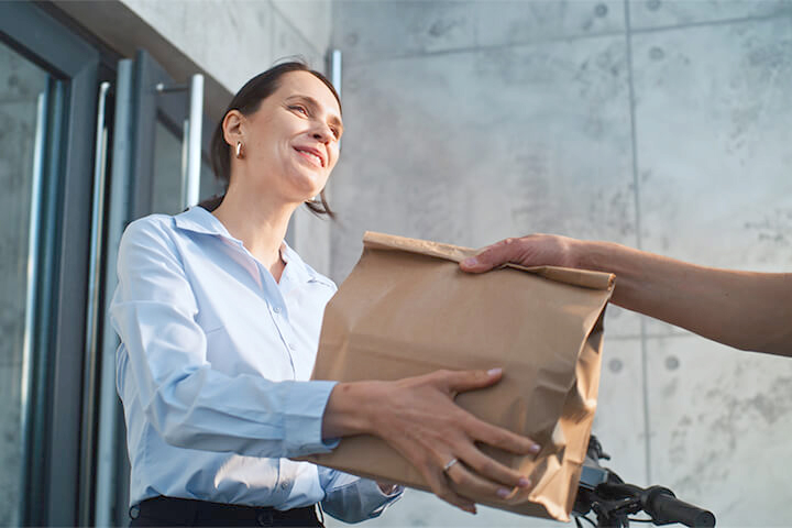 A woman receives a package,
