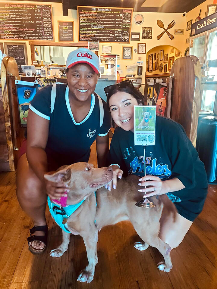 Two patrons and their shelter dog out for an adventure.