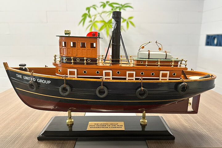 Award that looks like a tug boat.