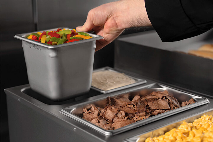 The 3-Well Thermalizer by Vollrath fits third-size and sixth-size steam table pans up to 6 inches deep.