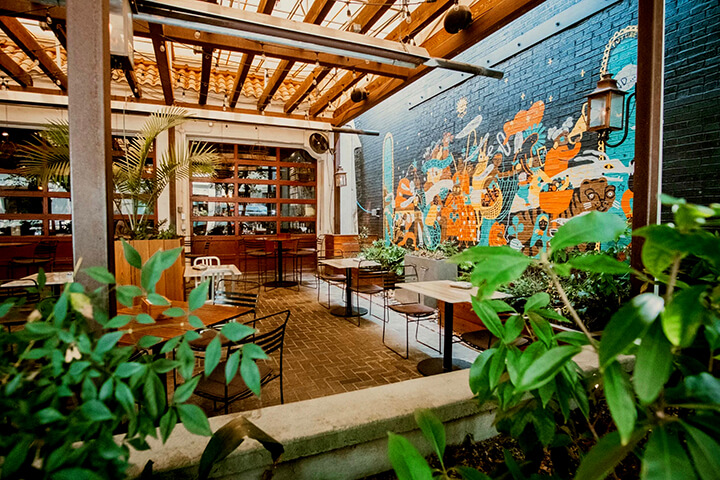 The stylishly cheerful interior of Leons Full Service in Decatur, GA, located in an old gas station. 