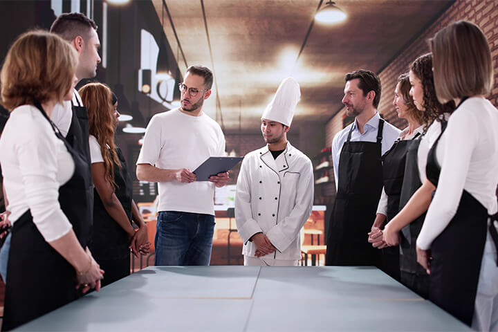 A restaurant team discusses the pros and cons of tip pooling.
