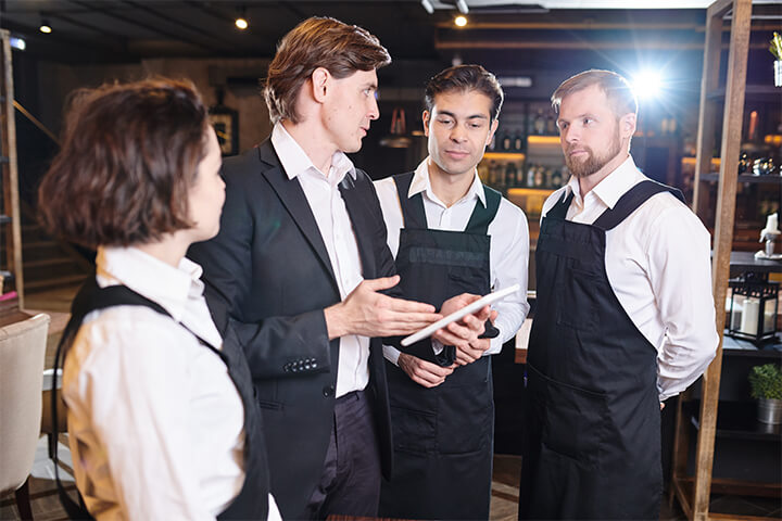 A group of work chums chat.