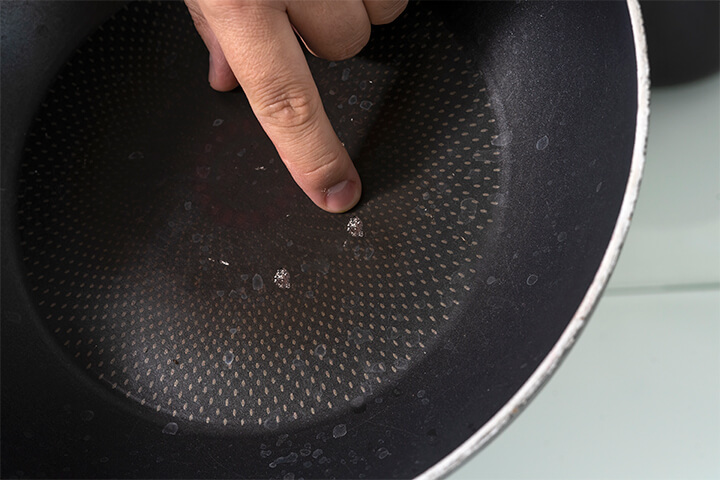 A nonstick pan with chips. 